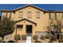 Traditional two-story home featuring symmetrical design, desert landscaping, and a welcoming front entrance at 16648 W Jenan Dr, Surprise, AZ 85388