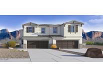 Charming townhome showcasing a two-car garage, modern architectural details, and mountain views at 21056 N 58Th St, Phoenix, AZ 85054