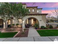 Charming two-story home with landscaped front yard and inviting porch with the address 4251 visible at 4251 N Golf Dr, Buckeye, AZ 85396