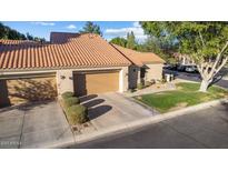 Charming single-story home with a well-maintained tile roof and attached two-car garage at 45 E 9Th Pl # 12, Mesa, AZ 85201