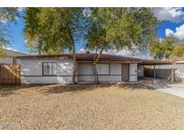 Cozy single story home with desert landscaping and mature trees in the front yard at 7022 N 26Th Dr, Phoenix, AZ 85051