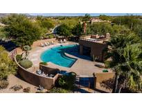 Aerial view of the large outdoor pool and patio area, surrounded by desert landscaping at 8502 E Cave Creek Rd # 10, Carefree, AZ 85377