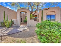 Inviting front entrance with desert landscaping and secure gated entry, creating curb appeal at 10040 E Happy Valley Rd # 249, Scottsdale, AZ 85255