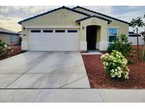 Charming single-story home featuring a two-car garage, landscaped front yard, and neutral stucco facade at 1418 E Peggy Dr, Casa Grande, AZ 85122