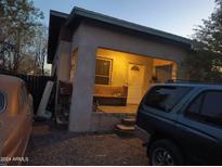 Quaint home exterior with a covered front porch and ample parking space at 1637 E Brill St, Phoenix, AZ 85006