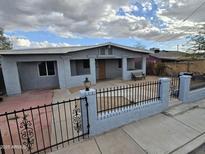 Charming single-story home featuring a fenced yard and covered porch, perfect for enjoying the outdoors at 535 E Agua Fria Ln, Avondale, AZ 85323