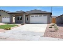 Charming single-story home featuring a neutral color palette, a spacious driveway, and a well-maintained front yard with desert landscaping at 913 E Fremont Rd # 3, Phoenix, AZ 85042