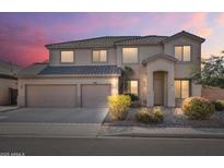 Charming two-story home with a three car garage and desert landscaping at 9237 W Alex Ave, Peoria, AZ 85382