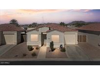 Charming single-story home with low maintenance desert landscaping, with mountain views in the background at 9718 E Boston St, Mesa, AZ 85207