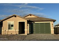 Charming single-story home with a well-manicured front yard and a spacious two-car garage at 13242 W Hackamore Dr, Peoria, AZ 85383