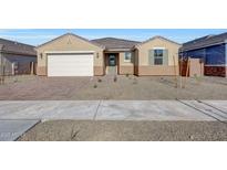 Charming single-story home with a paved driveway and a well-maintained front yard at 14782 W El Cortez Pl, Surprise, AZ 85387