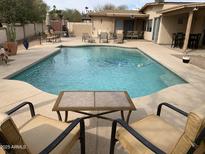 Inviting backyard pool with lounge seating perfect for relaxing and entertaining on a sunny day at 17429 E La Pasada Dr, Fountain Hills, AZ 85268