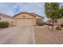 Charming single-story home with low-maintenance desert landscaping and an attached two-car garage at 233 N 21St St, Coolidge, AZ 85128