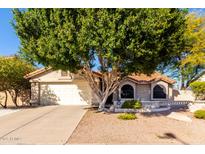 Charming single-story home featuring a well-maintained yard and a two-car garage at 5802 E Fountain St, Mesa, AZ 85205