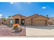 Charming single-story home with three-car garage and low maintenance desert landscaping at 6881 W Greenbriar Dr, Glendale, AZ 85308