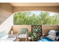 Relaxing outdoor patio featuring comfortable seating and view of lush greenery at 9550 E Thunderbird Rd # 259, Scottsdale, AZ 85260