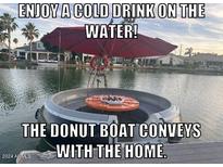 The Donut Boat, which is an additional bonus, allows for a nice boat ride right from your dock at 517 S Marina Dr, Gilbert, AZ 85233