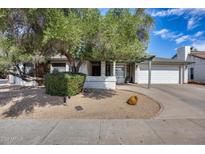 Charming single-story home featuring a well-maintained front yard and a two-car garage at 5532 W Onyx Ave, Glendale, AZ 85302