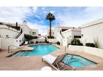 Resort-style living with a refreshing pool, spa, and desert landscaping at 7023 E 4Th St # 104, Scottsdale, AZ 85251
