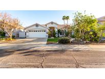 Charming single-story home showcasing well-maintained landscaping, desert plants, and a spacious two-car garage at 1573 W Chicago St, Chandler, AZ 85224