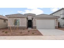 Charming single-story home with a two-car garage and low maintenance desert landscaping at 17843 W Encinas Ln, Goodyear, AZ 85338