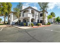 Beautiful condo complex with desert landscaping, red accents, and a gray and white color scheme at 600 W Grove Pkwy # 2188, Tempe, AZ 85283