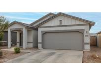 Charming single-story home with a two-car garage and well-maintained front yard at 9509 W Illini St, Tolleson, AZ 85353