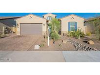 Charming single-story home with a desert-landscaped front yard and a two-car garage at 15843 S 177Th Ave, Goodyear, AZ 85338