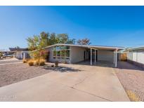 Charming single story home with covered parking and low-maintenance landscaping at 1660 W 7Th Pl, Mesa, AZ 85201