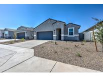 Charming single-story home with a desert-landscaped yard and a two-car garage at 3353 W Shanley Ave, Apache Junction, AZ 85120