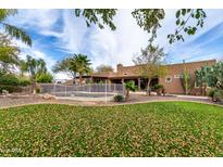 Expansive backyard with pool, mature landscaping, and privacy, perfect for outdoor entertaining at 38408 N 23Rd Dr, Phoenix, AZ 85086