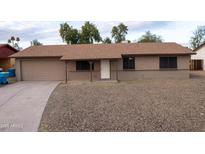 Cozy one-story home featuring a two-car garage and low-maintenance gravel landscaping at 4110 W Cholla St, Phoenix, AZ 85029
