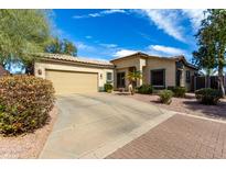 Charming single-story home with a well-maintained front yard, complemented by a two-car garage and desert landscaping at 6461 S Kimberlee Way, Chandler, AZ 85249