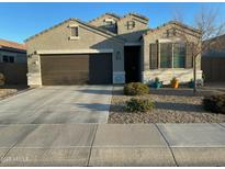 Charming single-story home featuring a well-manicured front yard and a two-car garage at 1242 E Lee Pl, Casa Grande, AZ 85122