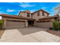 Spacious home boasting an attached three-car garage and well-maintained landscaping at 1917 S Rock Ct, Gilbert, AZ 85295