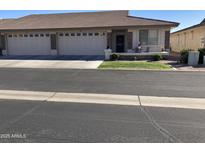 Charming single-story home featuring a three-car garage, low maintenance yard, and covered entry at 2662 S Springwood Blvd # 394, Mesa, AZ 85209