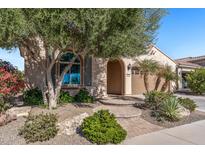 Charming home featuring a well-manicured front yard and covered entrance at 26880 W Sierra Pinta Dr, Buckeye, AZ 85396