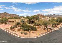 Stunning Southwest home with desert landscaping, mountain views, and a circular driveway at 8540 E Mcdowell Rd # 125, Mesa, AZ 85207