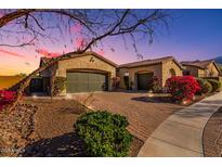Charming single-story home with a brick driveway, desert landscaping, and a two-car garage at 9013 S 15Th Way, Phoenix, AZ 85042