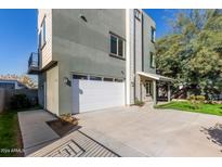 Modern two-story home featuring a two-car garage and neutral color palette at 2012 W Lawrence Rd, Phoenix, AZ 85015