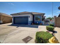 Charming single-story home featuring a well-maintained yard and an attached two-car garage at 5255 W Cochise Dr, Glendale, AZ 85302