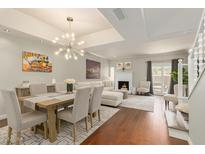 Open-concept living room with hardwood floors, fireplace, and ample natural light at 6229 N 30Th Way, Phoenix, AZ 85016