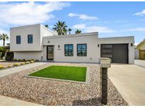 Modern home showcasing clean lines, a xeriscaped front yard, and desert landscaping at 6525 N 83Rd St, Scottsdale, AZ 85250