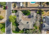 Bird's-eye view of a home featuring a circular driveway, lush landscaping, mature trees, and a well-maintained lawn at 801 W Tyson St, Chandler, AZ 85225