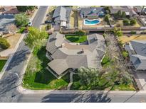 Stunning aerial view of an estate with a lush green lawn, a circular driveway, and beautiful mature trees at 801 W Tyson St, Chandler, AZ 85225