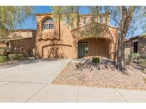 Inviting two-story home boasting a well-maintained yard, neutral stucco, and an attached two-car garage at 13672 W Chaparosa Way, Peoria, AZ 85383