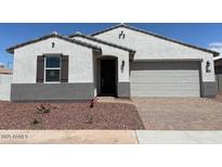 Charming single-story home with a two-car garage and a well-maintained, low-water landscape at 24612 W Grenadine Rd, Buckeye, AZ 85326