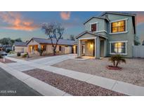 A delightful home showcasing desert landscaping, a two-car garage, and inviting curb appeal at 3360 E Joseph Way, Gilbert, AZ 85295