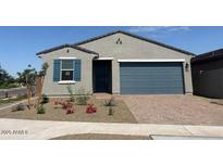 Charming single-story home with a two-car garage and a well-maintained front yard at 3822 S 87Th Dr, Tolleson, AZ 85353