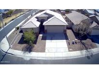 A stunning overhead view of a well-maintained single-Gathering home with a tile roof and a spacious driveway at 4405 W Park St, Laveen, AZ 85339